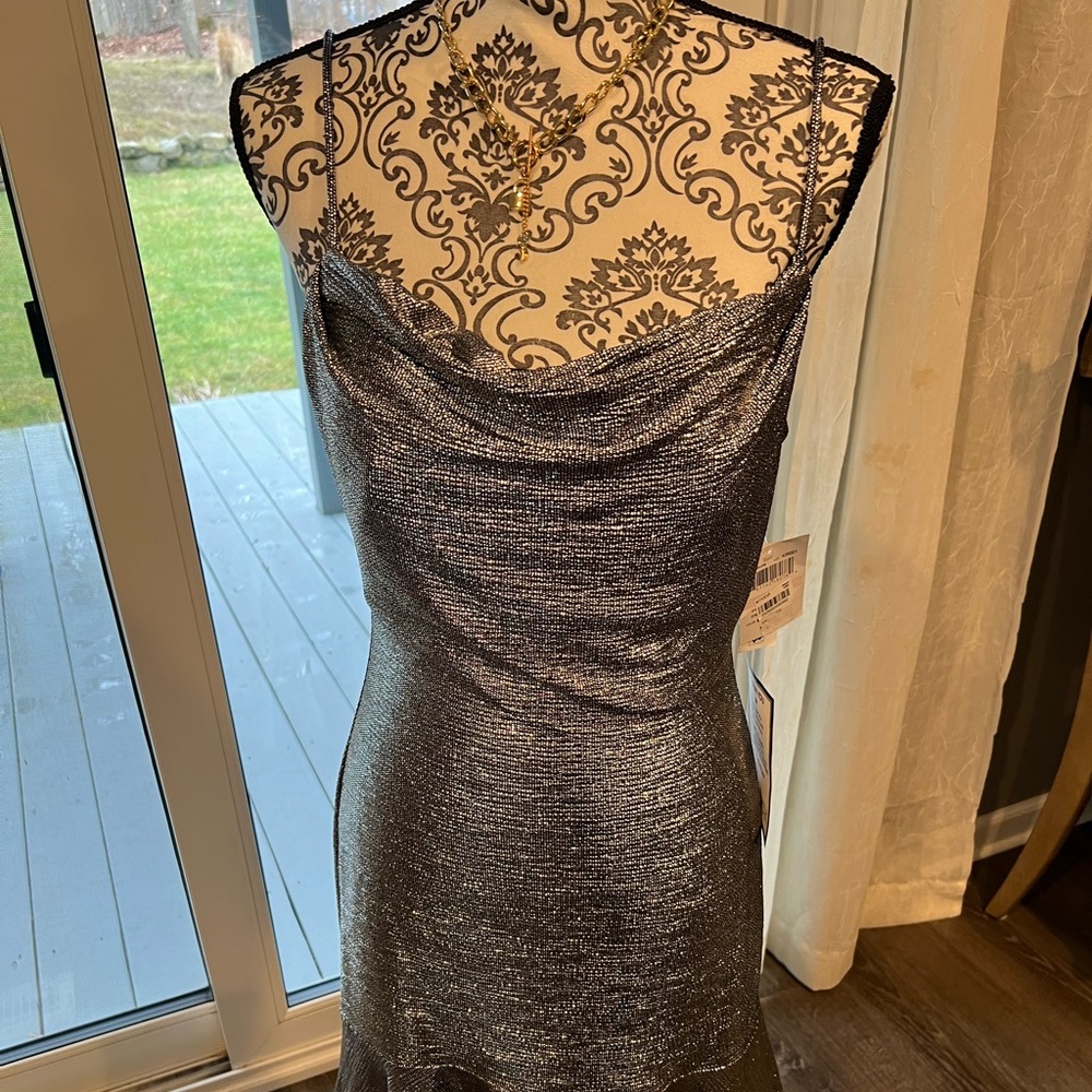 NWT. Spaghetti straps party dress. Sparkly, metallic material
